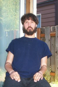 Me sitting next to a house